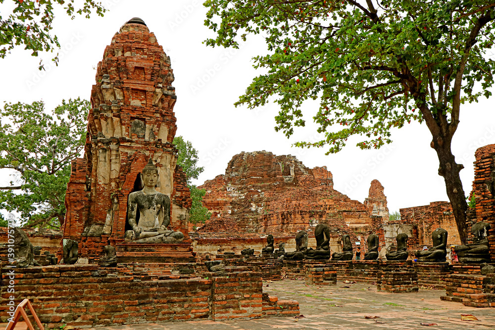 Group of Buddha Image Ruins in Wat Mahathat Temple or the Monastery of the Great Relic in Ayutthaya Historical Park, Thailand
