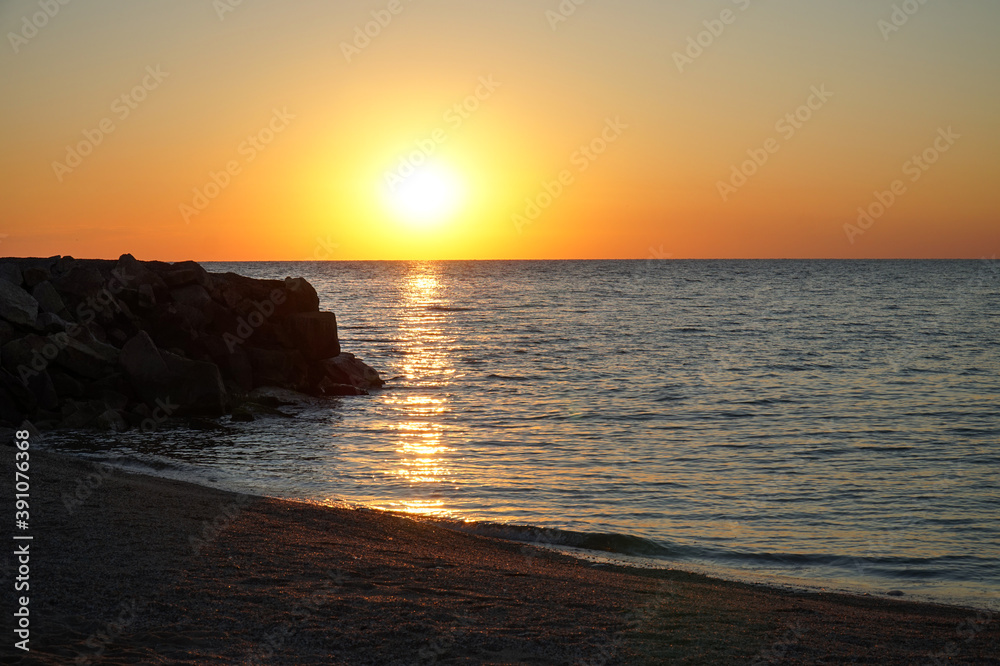 Seashore at dawn. Calm morning.                       