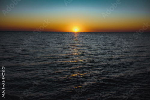 Rising sun over the sea. Early morning. photo