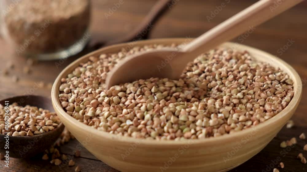 Green buckwheat in a bowl. Healthy eating, clean eating, detox diet concept Green buckwheat in a bowl. Healthy eating, clean eating, detox diet concept