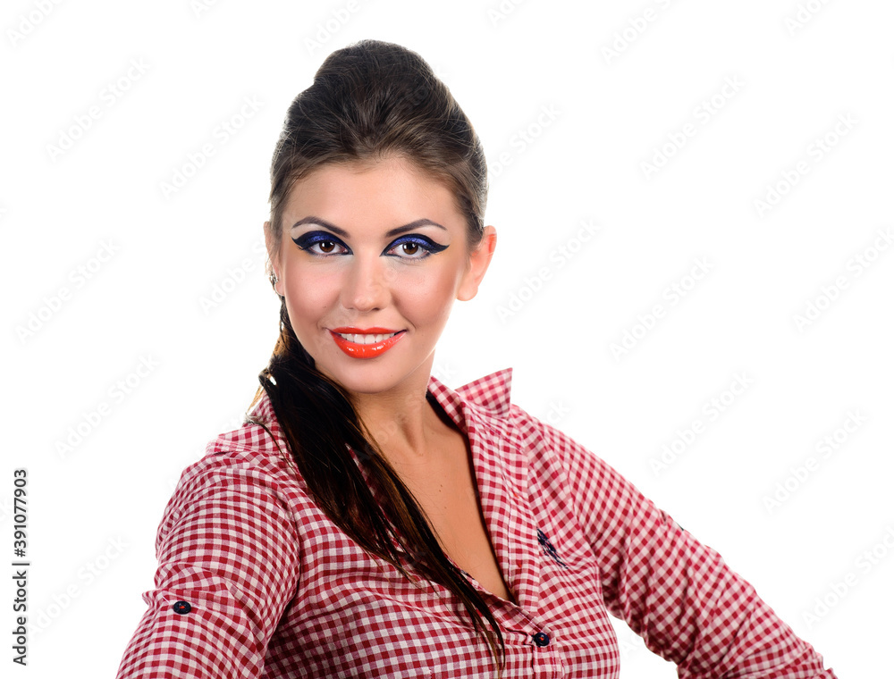 An attractive brunette with colorful makeup in a shirt smiles beautifully with white teeth. An attractive brunette with colorful makeup in a shirt smiles beautifully with white teeth.