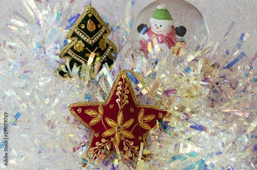 Christmas decorations, star, herringbone, ball with snowman and tinsel