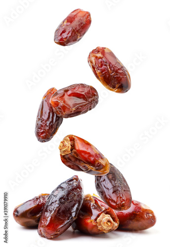 Dates fruit fly and fall on a pile on a white background. Isolated photo