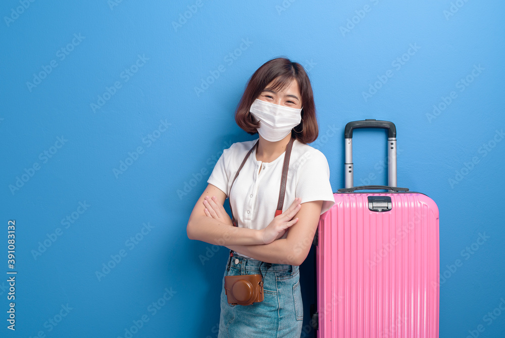 portrait of young traveler woman with face mask , New normal travel concept. portrait of young traveler woman with face mask , New normal travel concept.