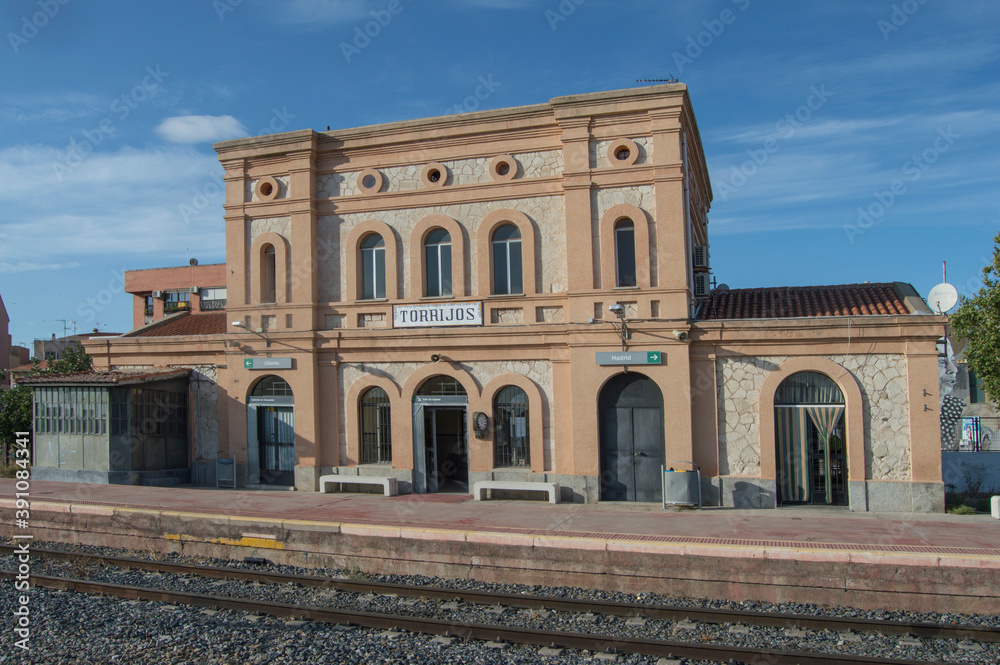 train station In Torrijos, in Toledo. Spain in the photograph appear the posters written in Spanish with the left destination Caceres. right destination Madrid. waiting room and circulation cabinet