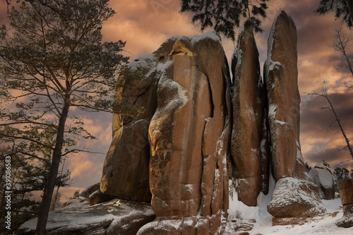 Feathers Rock in the Stolby Nature Sanctuary the city of Krasnoyarsk, Russia, Siberia. Majestic dusk at winter landscape. photo