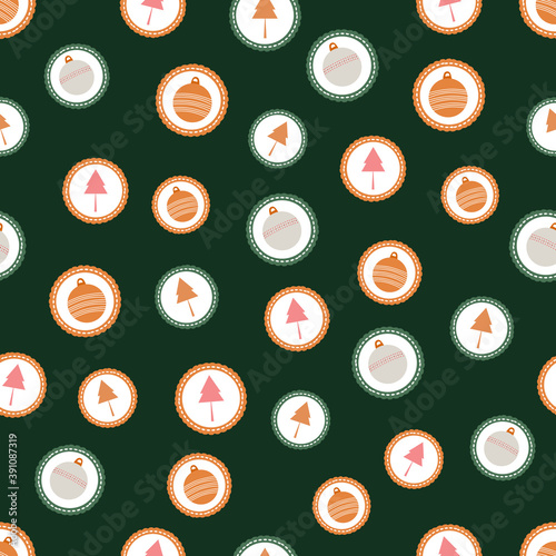 Seamless pattern of sweet winter holiday cookies with christmas trees and ornaments on a green background.