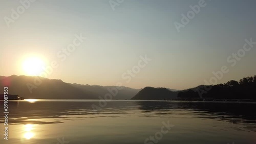 Srinakarin Dam in Kanchanaburi landmark for peace adventure travel holiday vacation panorama landscape view floating house sunset dusk lake river water fog mist nature reflection sky forest trees