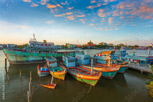 Many boats moored in sunrise morning time at Chalong port, Main port for travel ship to krabi and phi phi island, Phuket, Thailand photo