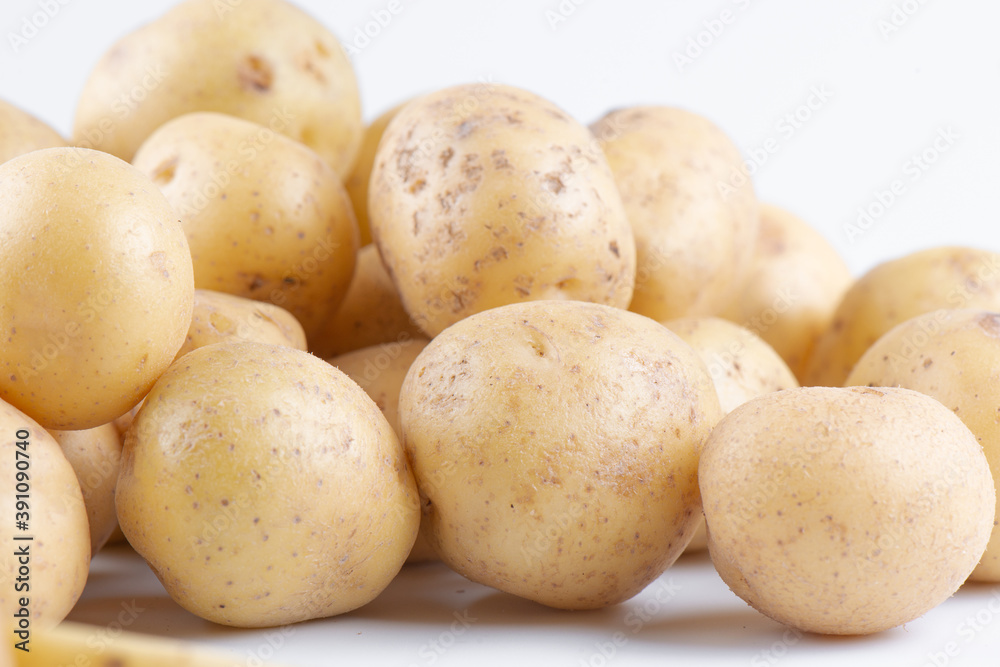 New raw potatoes isolated on white background close up New raw potatoes isolated on white background close up