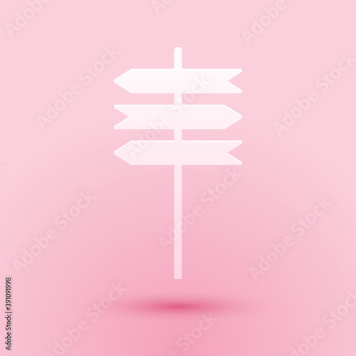 Paper cut Road traffic sign. Signpost icon isolated on pink background. Pointer symbol. Street information sign. Direction sign. Paper art style. Vector.