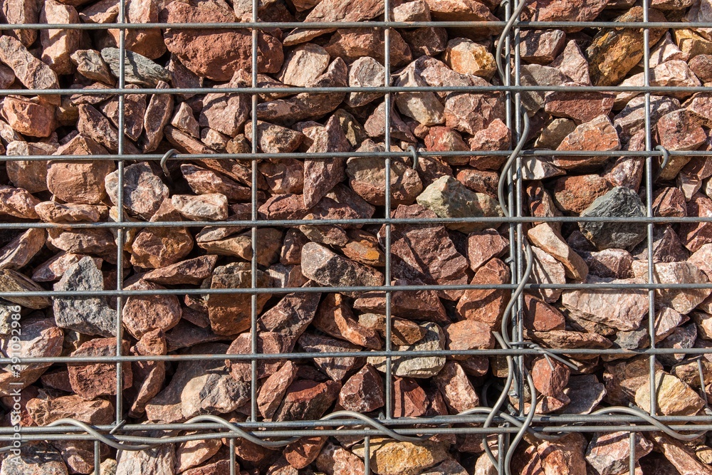 Retaining wall gabion baskets, Gabion wall caged stones textured background. Gabion wall caged stones.