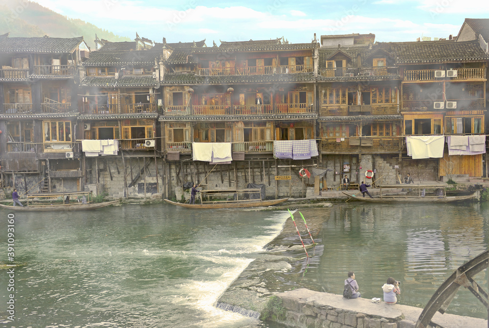 Hunan, China - Dec 2011 : Tourists and Travelers marvel at Landscape of Pheonix Ancient City (Fenghuang).