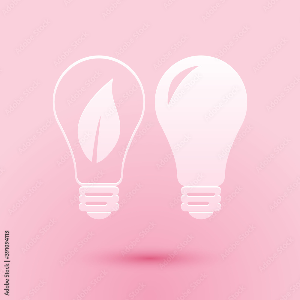 Paper cut Classic Lamp and Light bulb with leaf inside icon isolated on pink background. Lighting electric lamp. Green eco energy concept. Paper art style. Vector. Paper cut Classic Lamp and Light bulb with leaf inside icon isolated on pink background. Lighting electric lamp. Green eco energy concept. Paper art style. Vector.