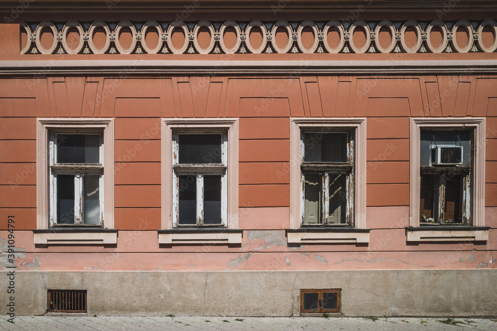 Wall with four windows on traditional architecture