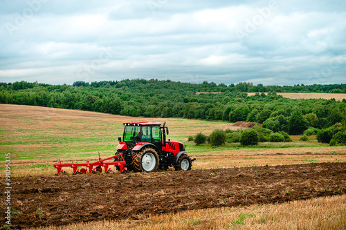 tractor plows the land