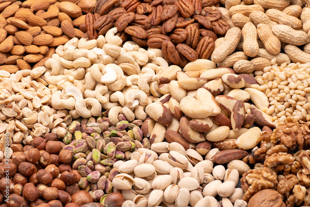 Assortment of various nuts such as cashew nuts, brazil nuts, peanuts, almonds, pecan and other Assortment of various nuts such as cashew nuts, brazil nuts, peanuts, almonds, pecan and other