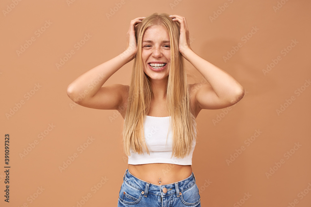 People, lifestyle, youth and teen age. Adorable happy 18 year old European girl with facial piercing and teeth braces looking with joyful broad smile, being in good mood, expressing positive emotions People, lifestyle, youth and teen age. Adorable happy 18 year old European girl with facial piercing and teeth braces looking with joyful broad smile, being in good mood, expressing positive emotions