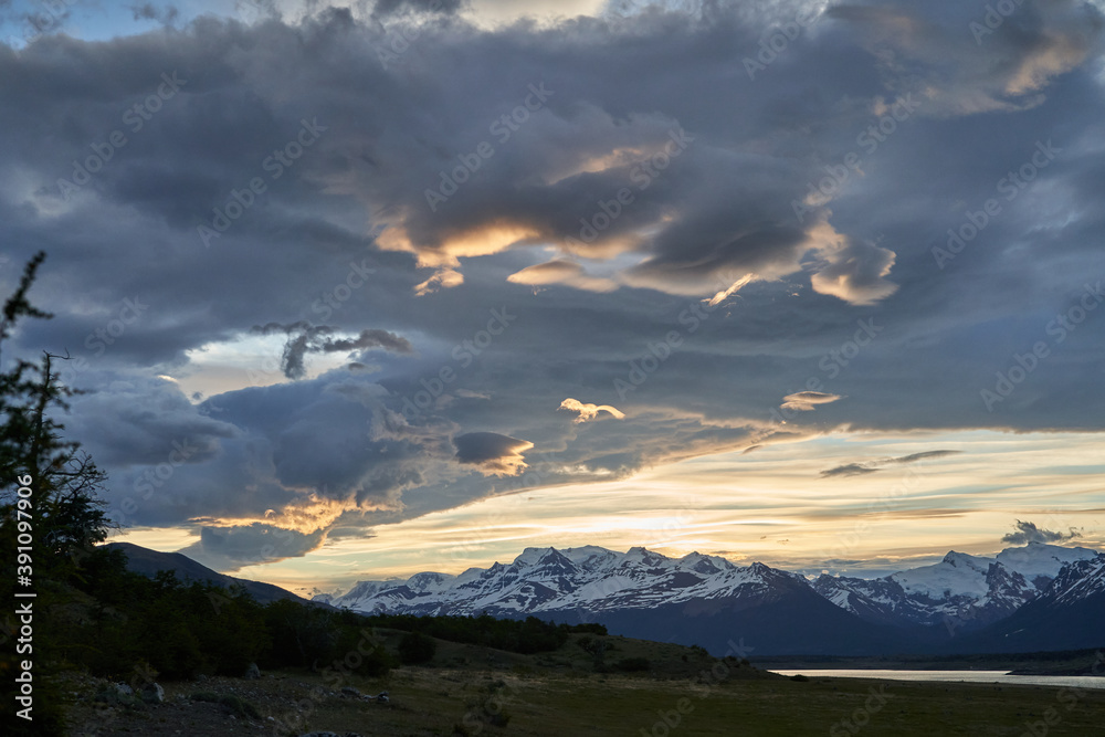 Moody sunset with dramatic clouds over the landscape of lago roca at Perito Moreno glacier in glacier national park in Patagonia, Argentina in south America with snow covered mountains of the Andes