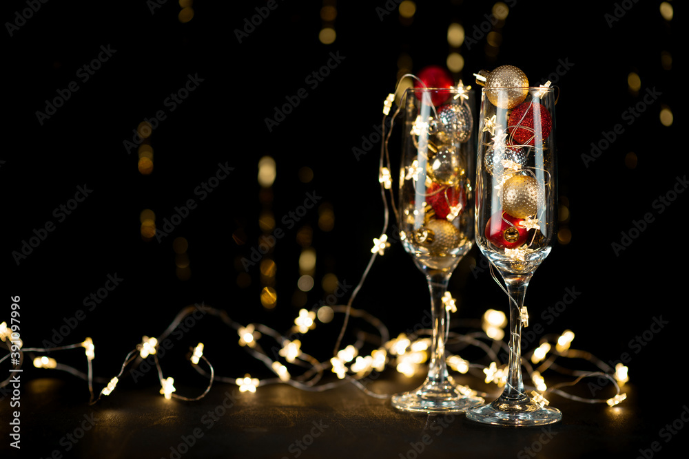 New year's holiday composition background with champagne glasses and bokeh