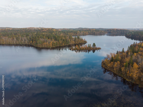 A small island in the middle of the lake. Autumn in the Russian North