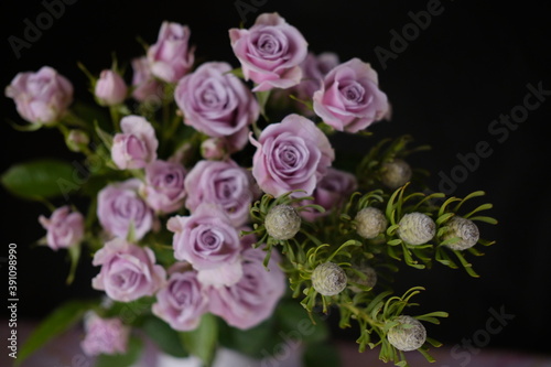 small rosebuds in a vase . flower shop