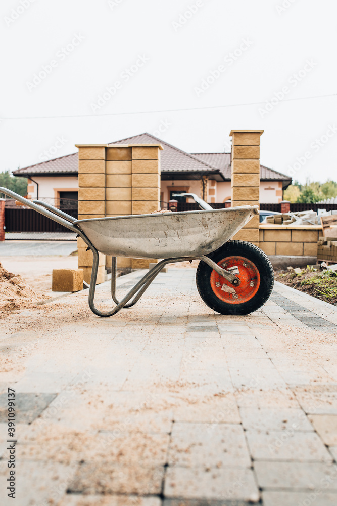 Metal construction wheelbarrow - transport of bulk materials at the construction site
