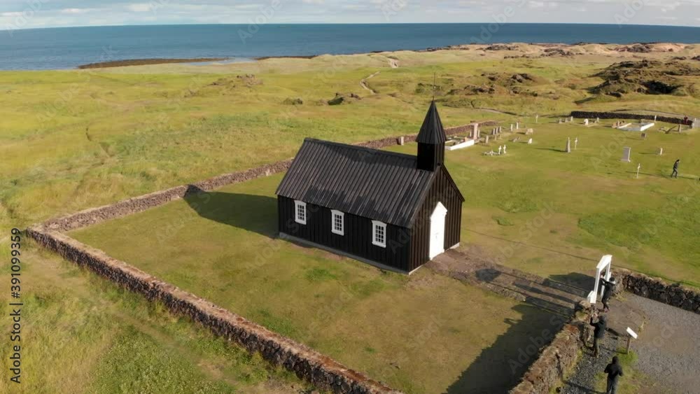 The Black Church Of Budir, Iceland. Aerial view at sunset from drone The Black Church Of Budir, Iceland. Aerial view at sunset from drone