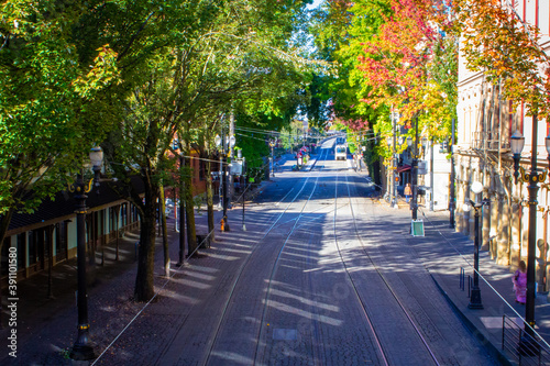 street with streetcar tracks in Portland, Oregon in early autumn