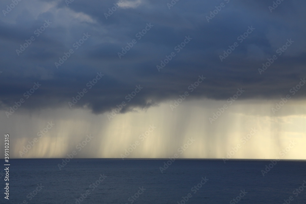 rain clouds over the sea