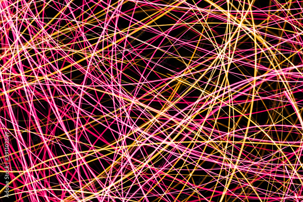 Neon lights background. Motion lines texture. Long exposure moving light pattern. Abstract night life background. Glowing lines design. Colorful illumination. Pink chaos texture. Neon lights background. Motion lines texture. Long exposure moving light pattern. Abstract night life background. Glowing lines design. Colorful illumination. Pink chaos texture.