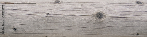 Bleached stained reclaimed wood surface with aged dry texture. Vintage wood background. 