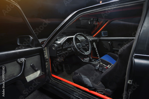 sports car interior with roll cage and drift handbrake night photography