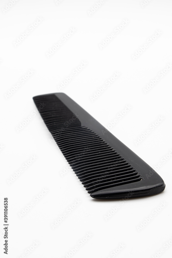 Black comb on a white background Black comb on a white background