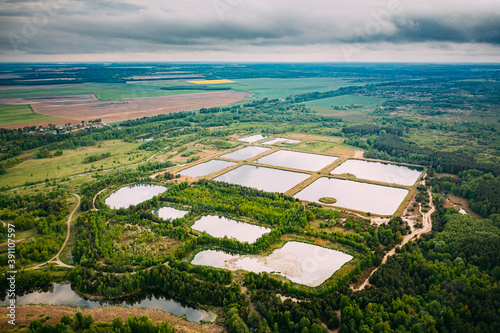 Aerial View Retention Basins, Wet Pond, Wet Detention Basin Or Stormwater Management Pond, Is An Artificial Pond With Vegetation Around The Perimeter, And Includes A Permanent Pool Of Water In Its photo