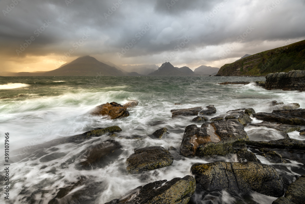Rough waves crashing on rocky shoreline at Elgol on the Isle of Skye, Scotland, UK. 