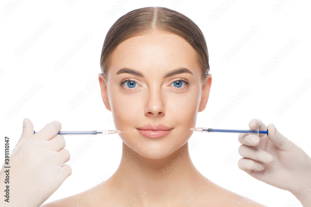 Close-up portrait of young woman standing with naked neck and shoulders, ready for face injection by beauty doctors, isoalted on white background Close-up portrait of young woman standing with naked neck and shoulders, ready for face injection by beauty doctors, isoalted on white background