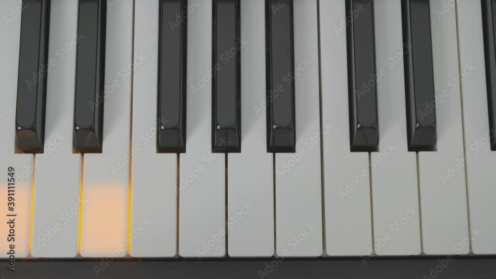 keys digital piano with backlight close-up top view. keys digital piano with backlight close-up top view.