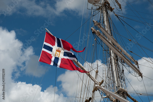 Fotografie Halmstad, Sweden - July 18 2010: Norwegian flag with royal monogram on a sail ship