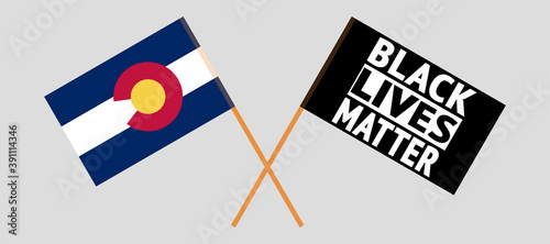 Crossed flags of The State of Colorado and blm