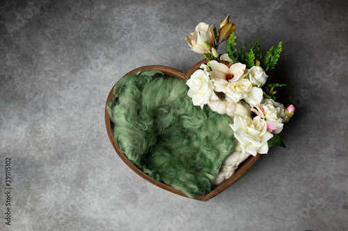 heart made of wood, decorated with roses. basket for a newborn photo shoot. white rose. heart