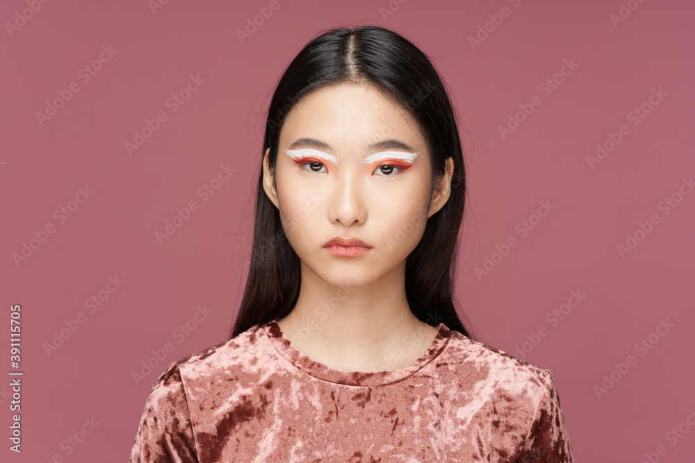 Woman with bright makeup close-up cropped view pink background Woman with bright makeup close-up cropped view pink background