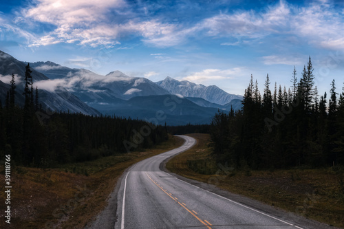 Beautiful View of a scenic road, Alaska Hwy, in the Northern Rockies. Colorful Twilight Sky Artistic Render. Taken in British Columbia, Canada. Nature Background Panorama