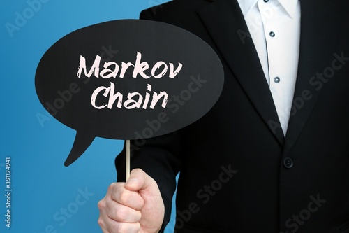 Markov Chain. Businessman holds speech bubble in his hand. Handwritten Word/Text on sign. photo