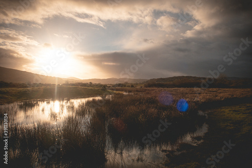 Flooded Lough Allua lake at sunset. southwest ireland. A lake lying on the river Lee which flows into Cork.	 photo