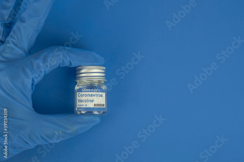 Fototapeta Naklejka Na Ścianę i Meble -  vials with the Covid-19 vaccine on a laboratory bench. to combat the coronavirus  sars-cov-2 pandemic 14