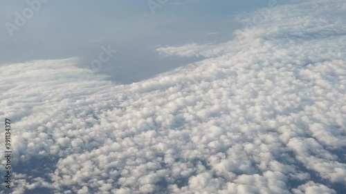 New normal Empty air traffic clear sky white cloud with sun from fly above high clouds view safe flight travel after coronavirus pandemic