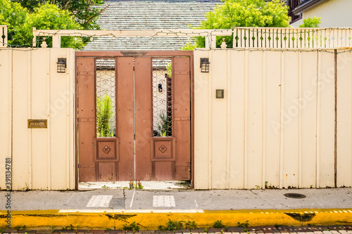 Metal Double Door Leading into a Courtyard