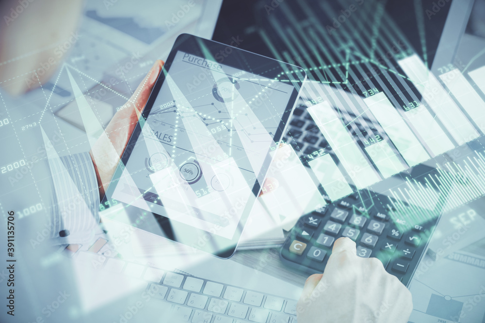 Double exposure of man's hands holding and using a digital device and forex graph drawing. Financial market concept. Double exposure of man's hands holding and using a digital device and forex graph drawing. Financial market concept.