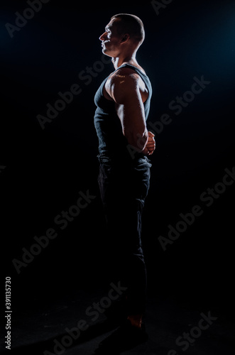 Bodybuilder posing in studio © qunica.com